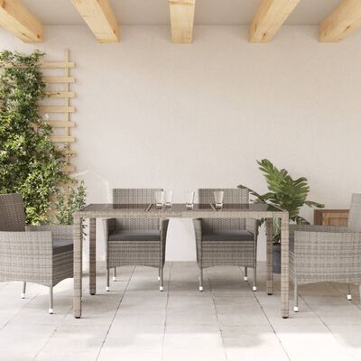 vidaXL Table de jardin 150x90x75cm Verre trempé et résine tressée Gris